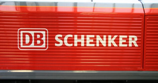 Side of a DB Cargo UK class 66 locomotive when the company was called DB Schenker UK. (CC BY SA) KITMASTERBLOKE-Wikimedia Commons. Image cropped.