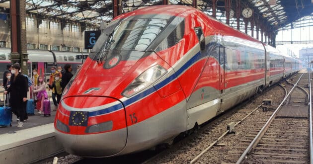 Trenitalia Frecciarossa 1000 train at Paris Gare de Lyon (CC BY SA) STIG124-Wikimedia Commons. Cropped image.